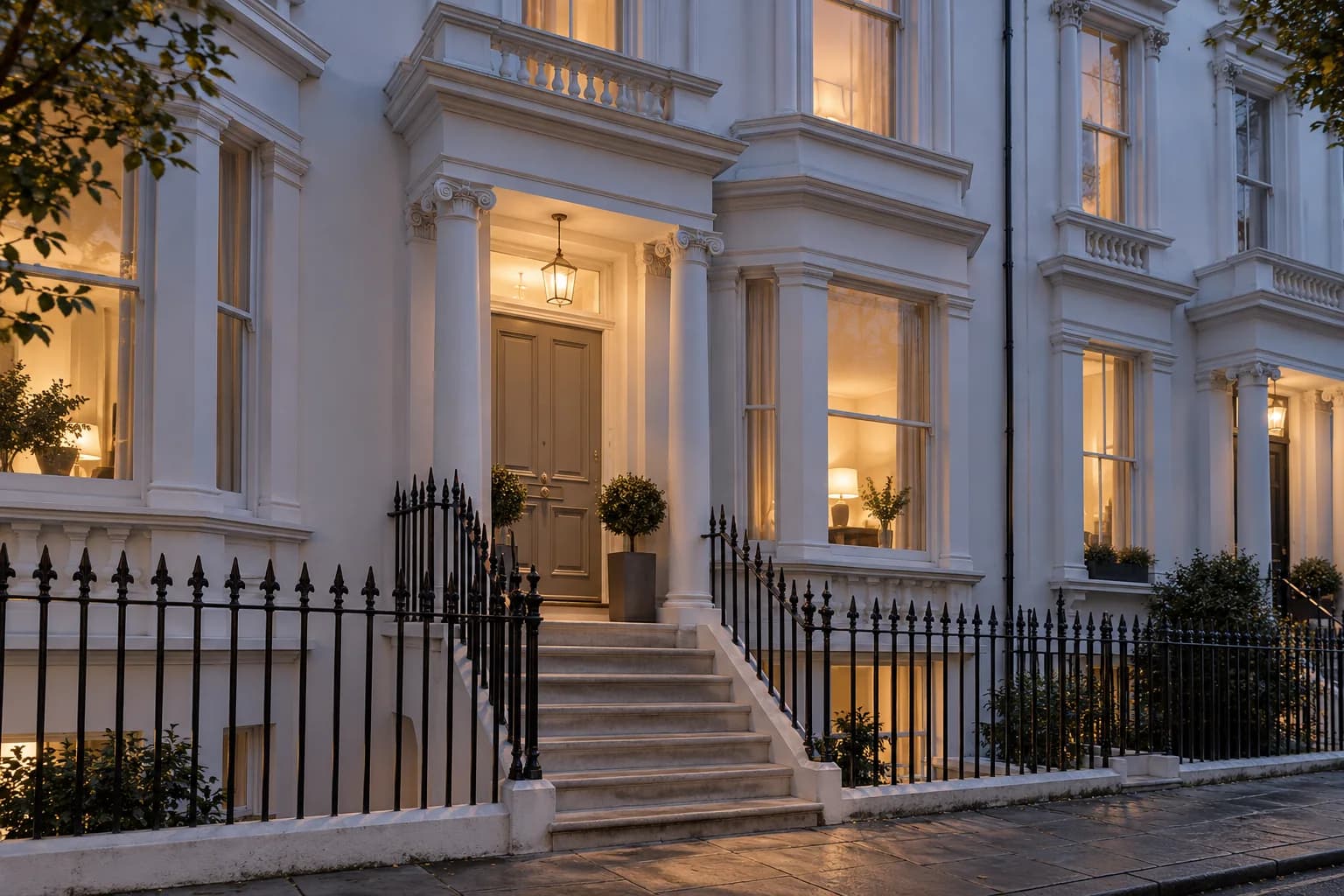 Unbranded Victorian guest-house frontage with stucco detailing and tall sash windows